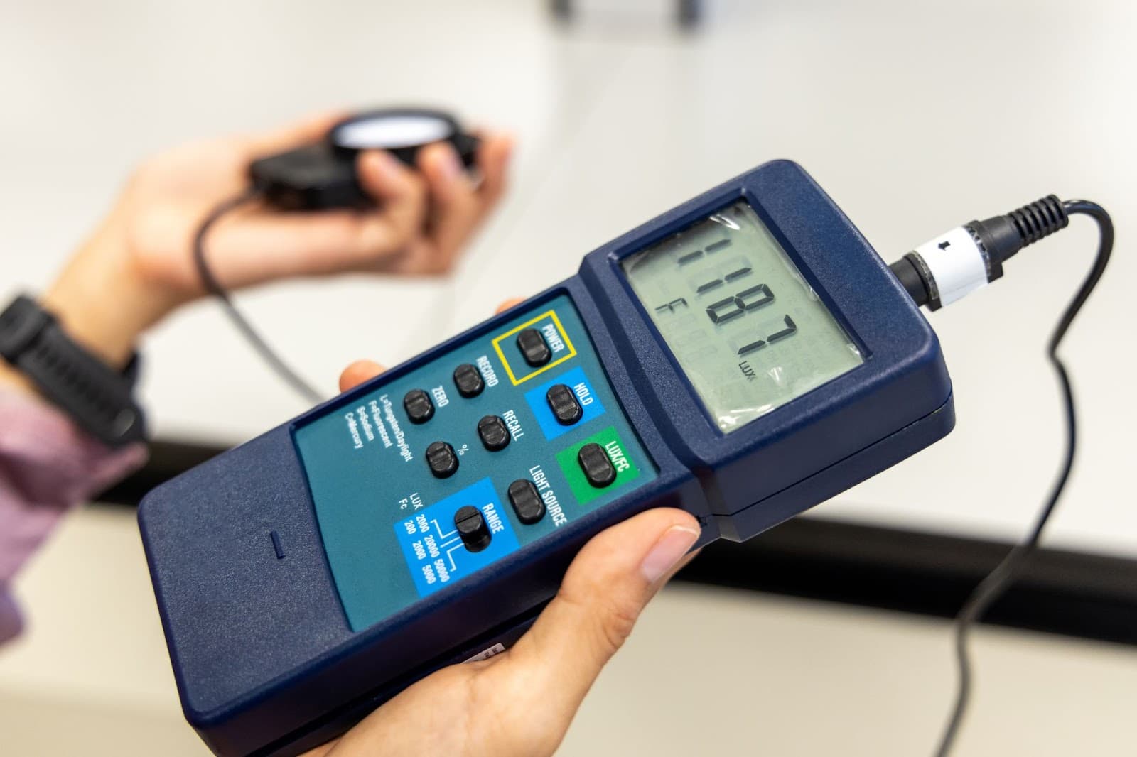 a Lux meter in a growers hands